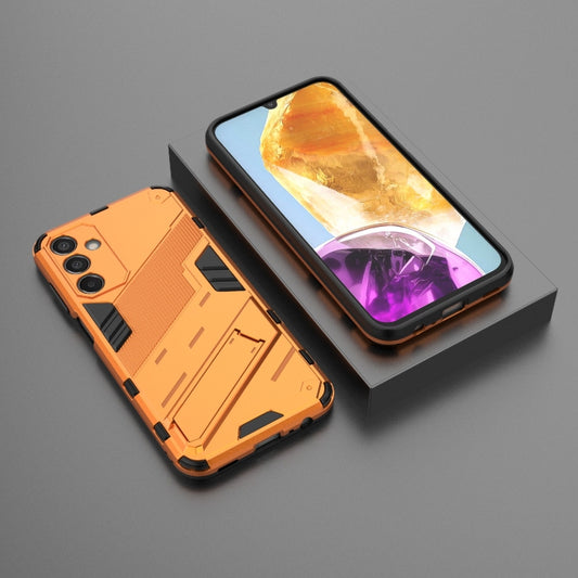 For Samsung Galaxy M15 5G Global Punk Armor 2 in 1 PC + TPU Shockproof Phone Case with Invisible Holder(Orange) by buy2fix