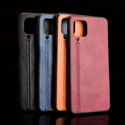 For Samsung Galaxy M32 4G Shockproof Sewing Cow Pattern Skin PC + PU + TPU Case(Orange) by buy2fix