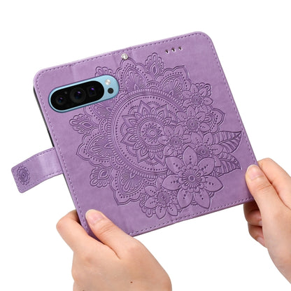 For Google Pixel 9 Seven-petal Flowers Embossing Leather Phone Case(Light Purple) by buy2fix