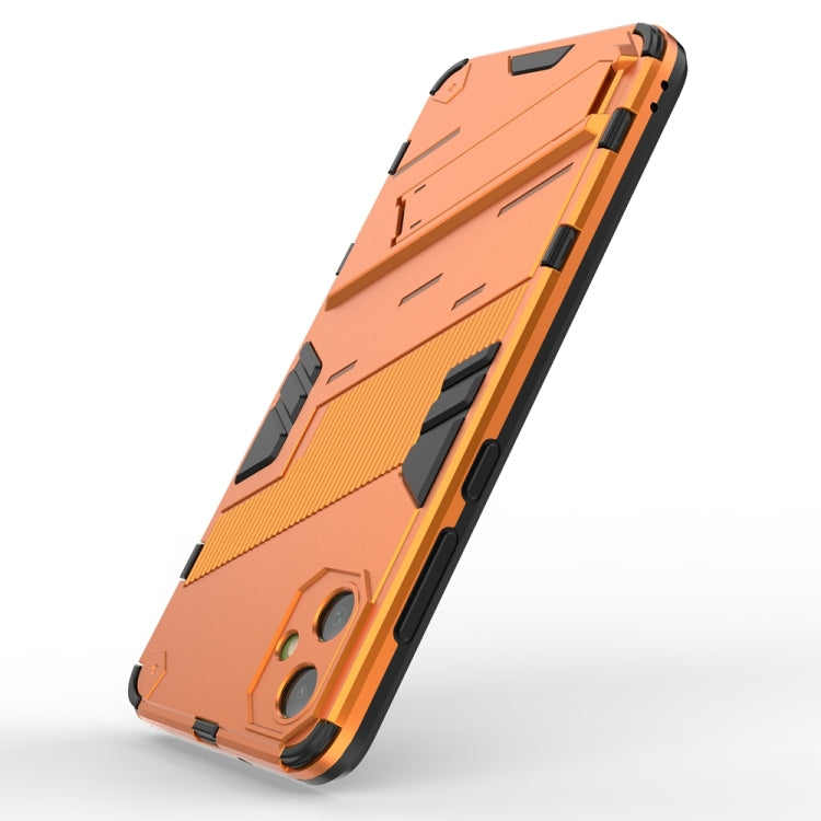 For Samsung Galaxy A05 4G Punk Armor 2 in 1 PC + TPU Shockproof Phone Case with Invisible Holder(Orange) by buy2fix