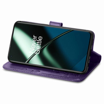 For OnePlus 11 Four-leaf Clasp Embossed Buckle Leather Phone Case(Purple) - OnePlus Cases by buy2fix | Online Shopping UK | buy2fix