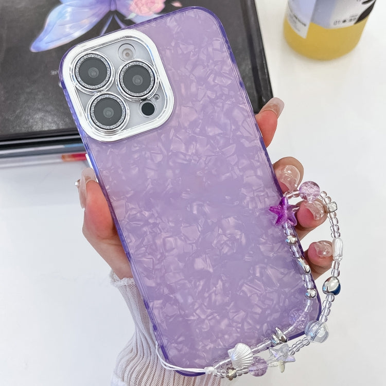 For iPhone 16 Pro Plating Glitter Texture Chain Wristband TPU Phone Case with Lens Film(Purple Shell Pattern) by buy2fix