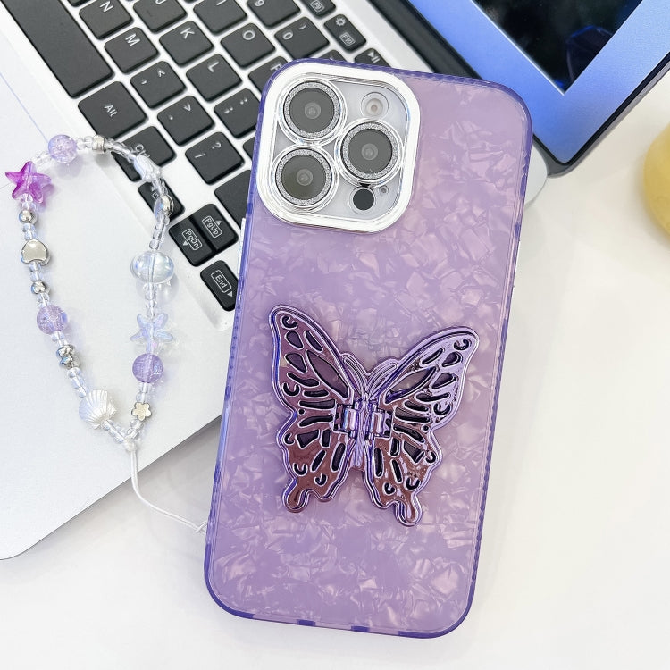 For iPhone 16 Pro Plating Glitter Lens Film Texture Butterfly Holder Wristband Phone Case(Purple Shell Pattern) by buy2fix