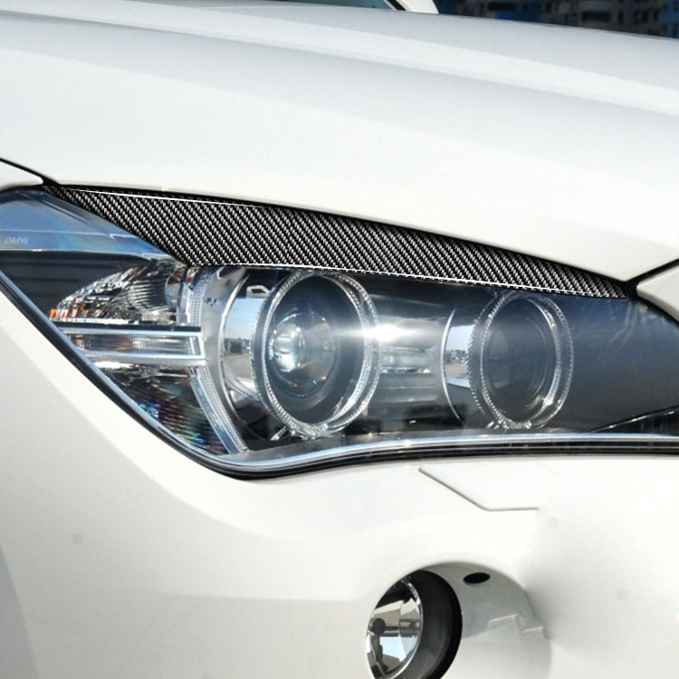 2 PCS / Set Carbon Fiber Car Lamp Eyebrow Decorative Sticker for BMW X1/E84 2009-2014, Drop Glue Version by buy2fix