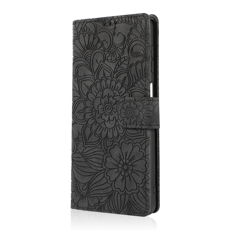 For Samsung Galaxy A12 Skin Feel Embossed Sunflower Horizontal Flip Leather Case with Holder & Card Slots & Wallet & Lanyard(Black) by buy2fix