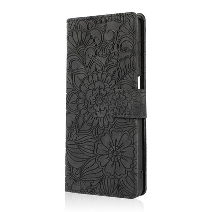 For Samsung Galaxy A12 Skin Feel Embossed Sunflower Horizontal Flip Leather Case with Holder & Card Slots & Wallet & Lanyard(Black) by buy2fix