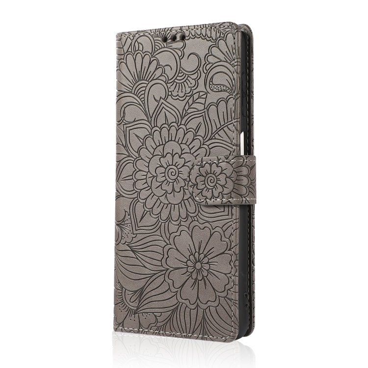 For Samsung Galaxy A12 Skin Feel Embossed Sunflower Horizontal Flip Leather Case with Holder & Card Slots & Wallet & Lanyard(Gray) by buy2fix